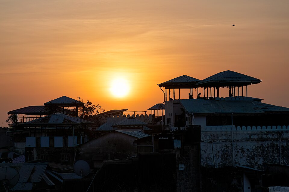 Illustrative Stone Town sunset, not the Fifth restaurant rooftop
